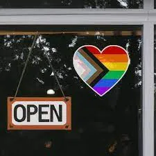 Pride stickers on a coffee shop door